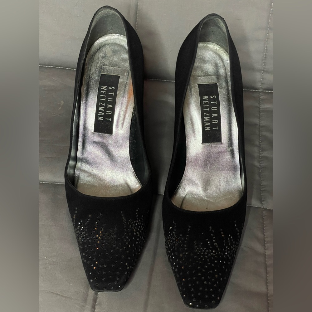 Stuart Weitzman slip on heels with toe embellishment.